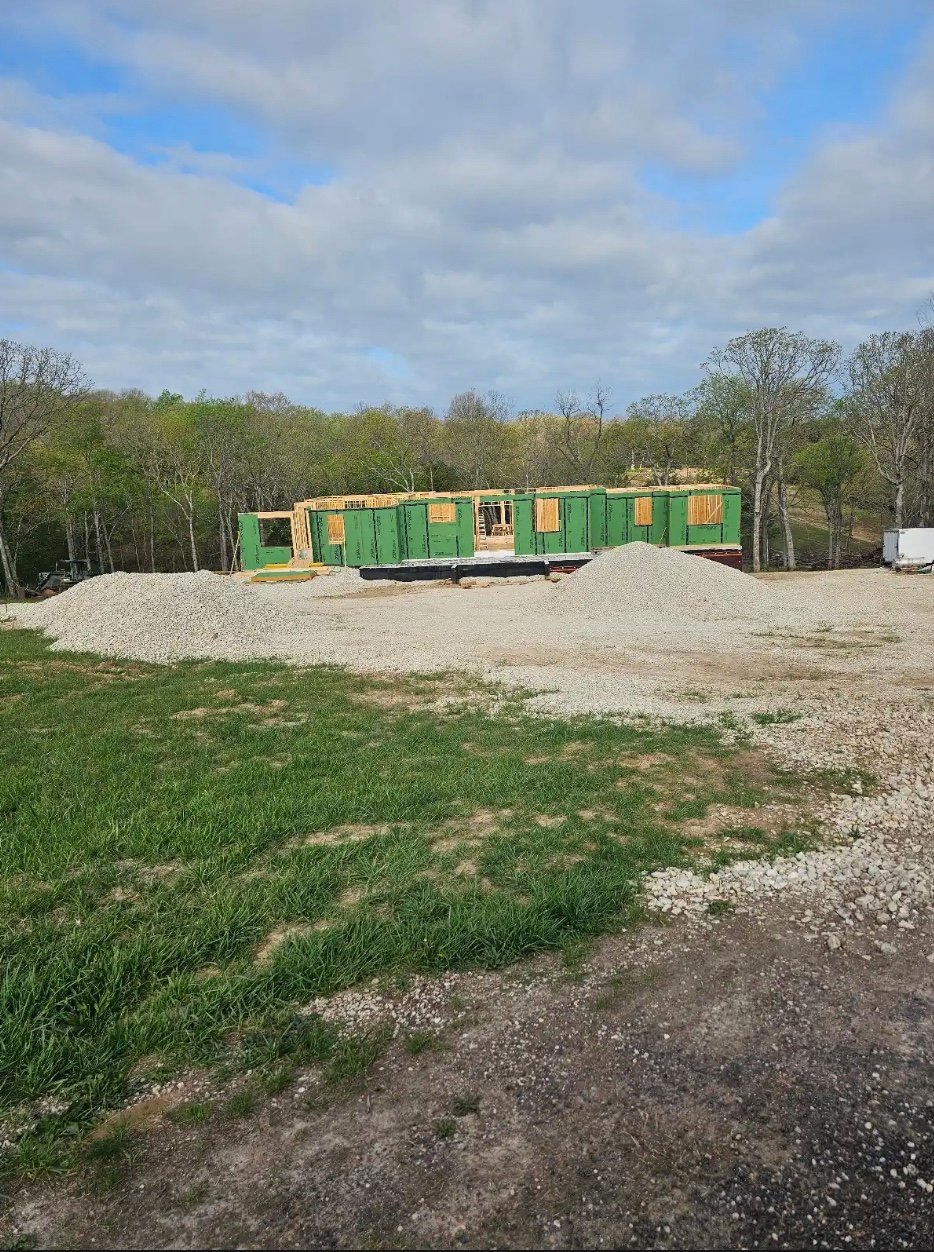 Modular construction trailer on a gravel lot